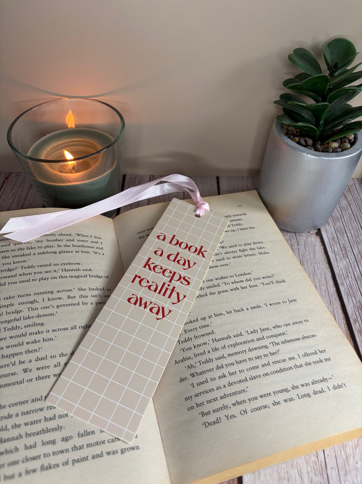 A book a day keeps reality away bookmark